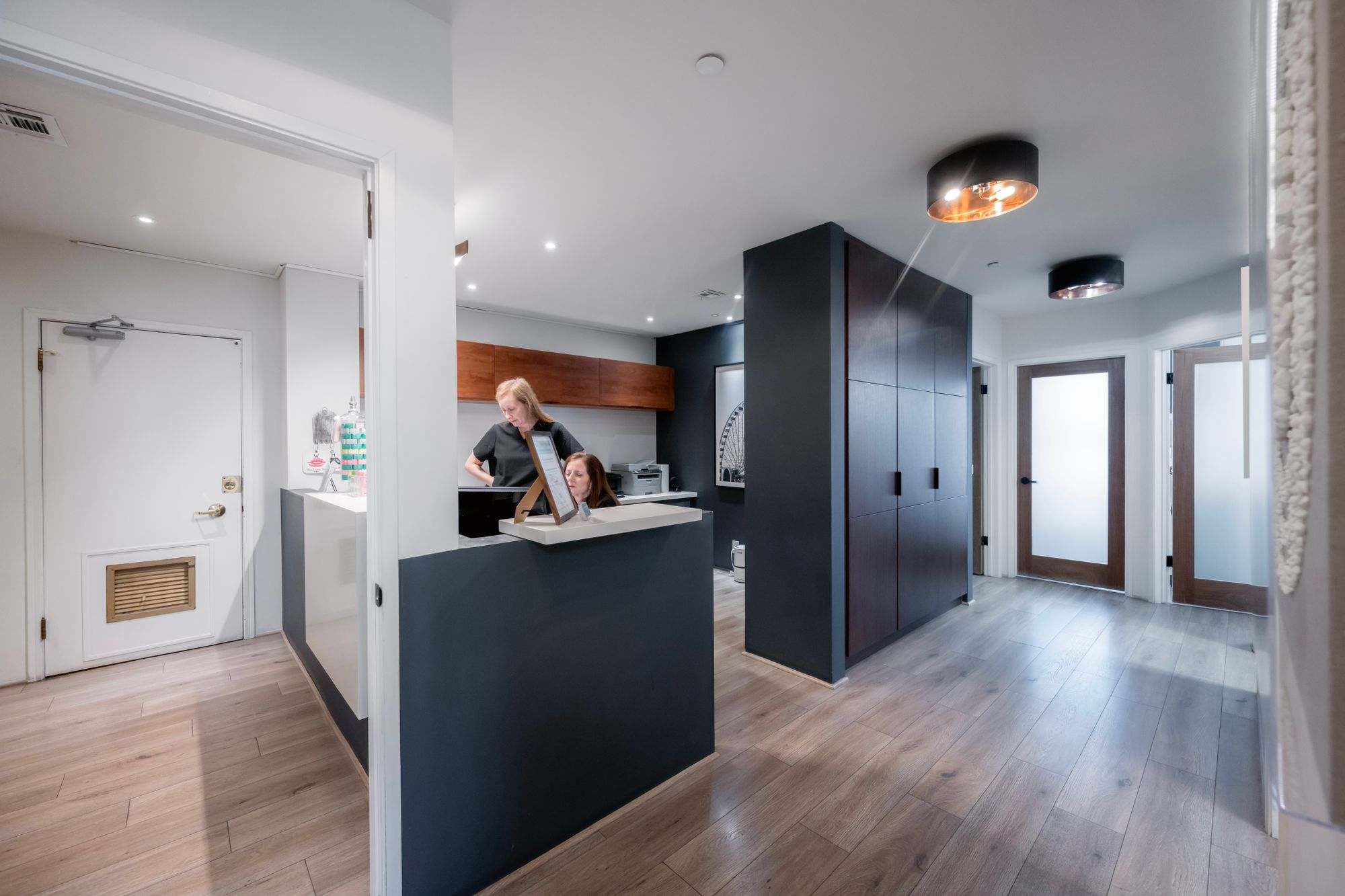 The reception desk and waiting area of a modern dental office