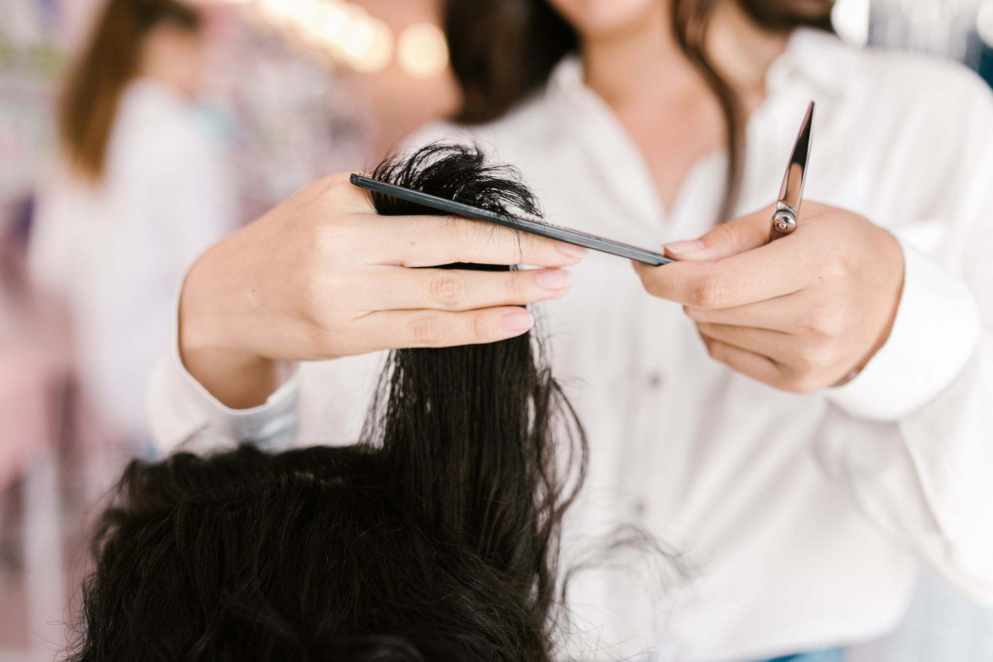 A hairdresser cutting a client’s hair