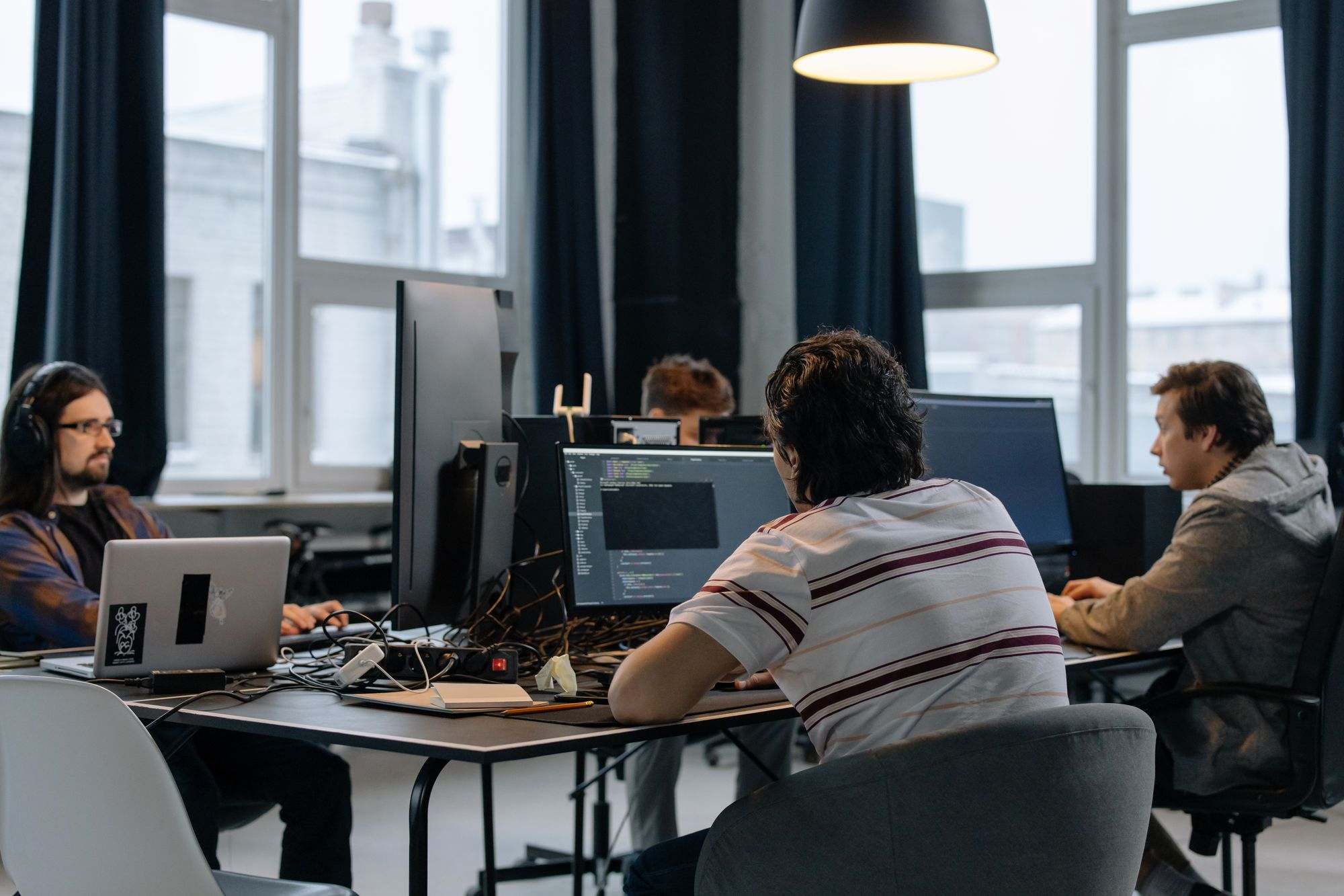 A software team working at computers in an open office