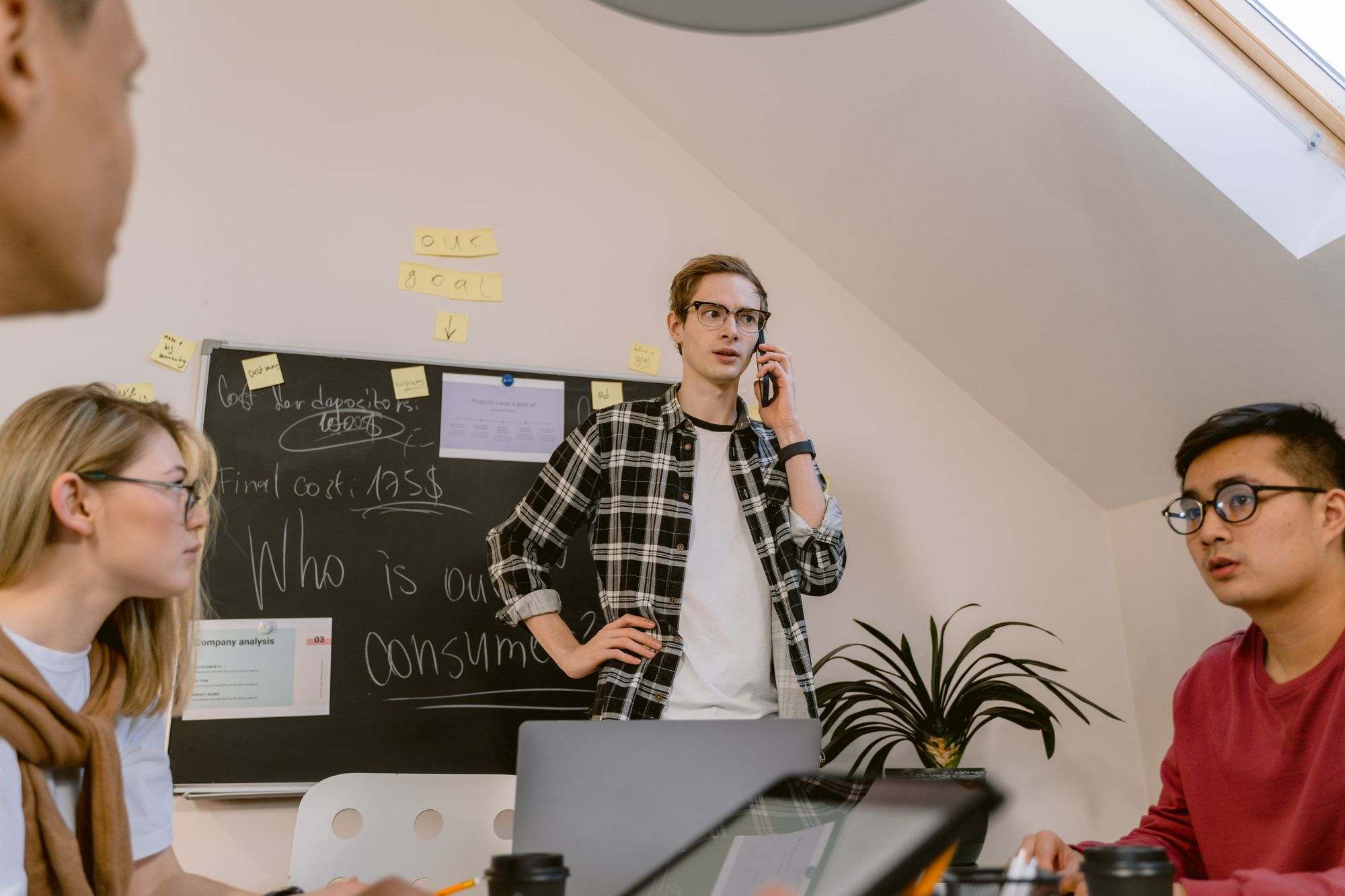 A small startup team talking through ideas in an office